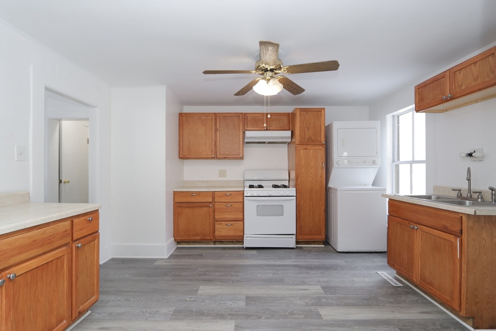 56 Middlefield Road Chester, MA 01011 - Photo 12 of 38 a kitchen with stainless steel appliances a stove a sink and a refrigerator