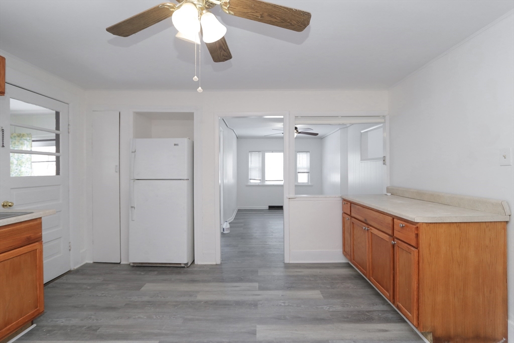 56 Middlefield Road Chester, MA 01011 - Photo 13 of 38 a kitchen with stainless steel appliances granite countertop a refrigerator a sink dishwasher a stove and white countertops with wooden floor