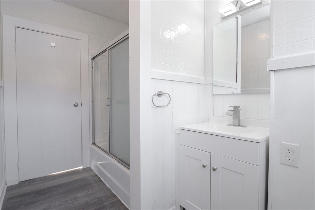 56 Middlefield Road Chester, MA 01011 - Photo 24 of 38 a bathroom with a granite countertop sink a mirror and vanity