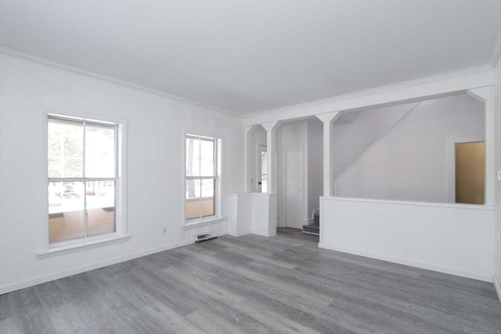 56 Middlefield Road Chester, MA 01011 - Photo 26 of 38 an empty room with wooden floor and windows