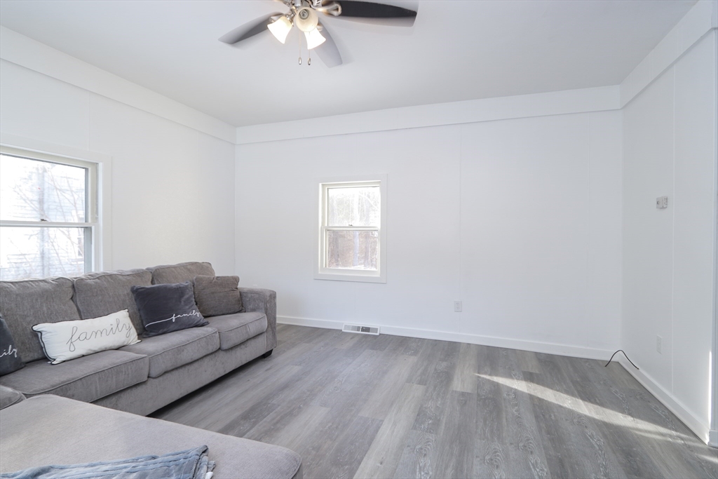 56 Middlefield Road Chester, MA 01011 - Photo 27 of 38 a living room with furniture and a hard wood floor