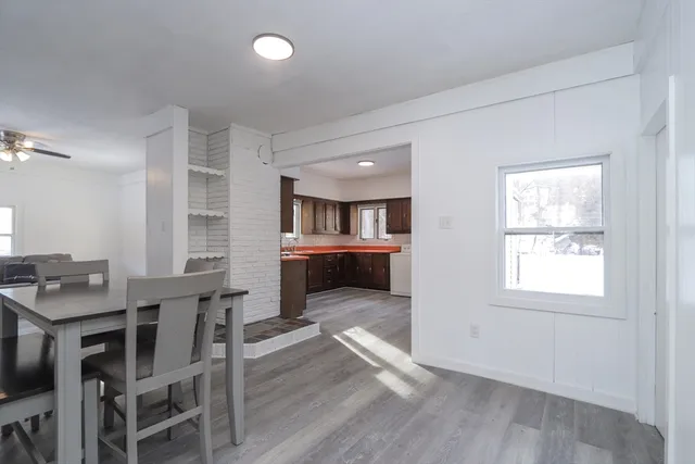 a view of a dining room with furniture and a livingroom
