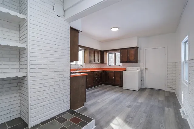 a kitchen with a sink and cabinets