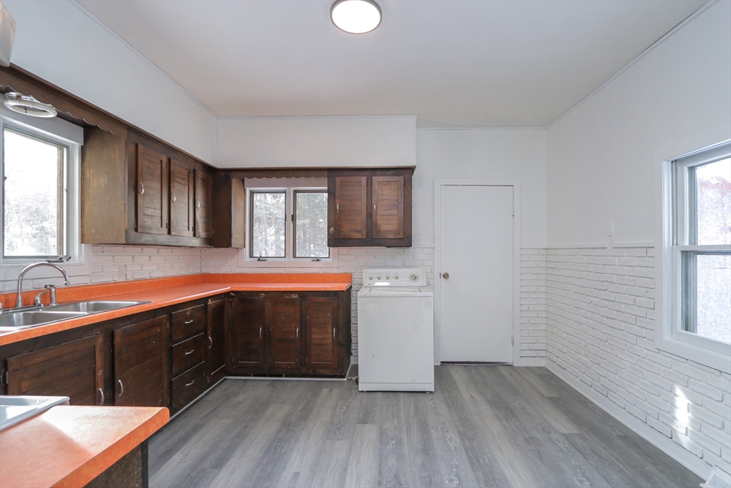 56 Middlefield Road Chester, MA 01011 - Photo 31 of 38 a spacious bathroom with a vanity a sink a mirror and a bathtub