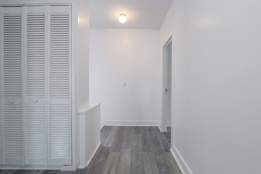 56 Middlefield Road Chester, MA 01011 - Photo 34 of 38 a view of a hallway with wooden floor and staircase