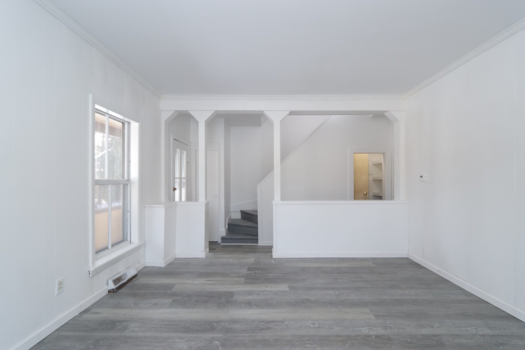 56 Middlefield Road Chester, MA 01011 - Photo 9 of 38 a view of an empty room with wooden floor and a window