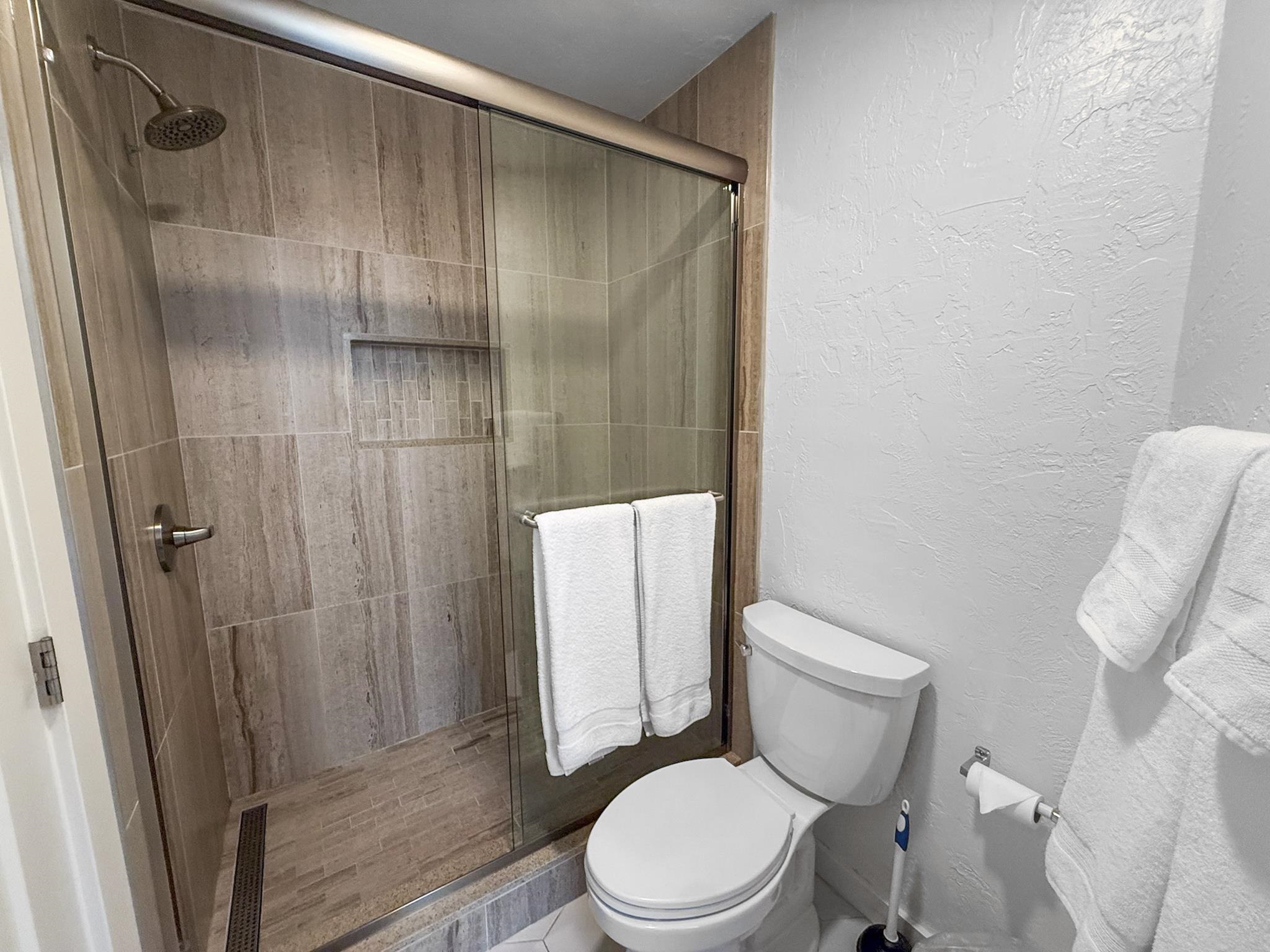 286 Old Mammoth Road, Unit 19 Mammoth Lakes, CA 93546 - Photo 11 of 19 a white toilet sitting next to a bathroom sink