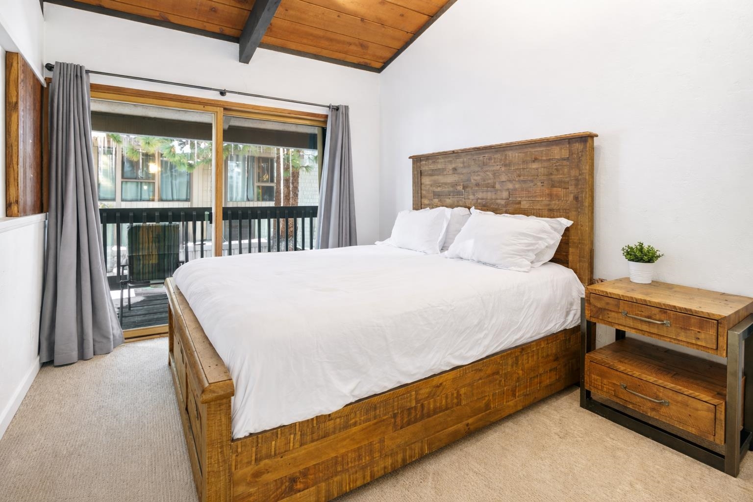 286 Old Mammoth Road, Unit 19 Mammoth Lakes, CA 93546 - Photo 13 of 19 a bed sitting in a bedroom next to a window