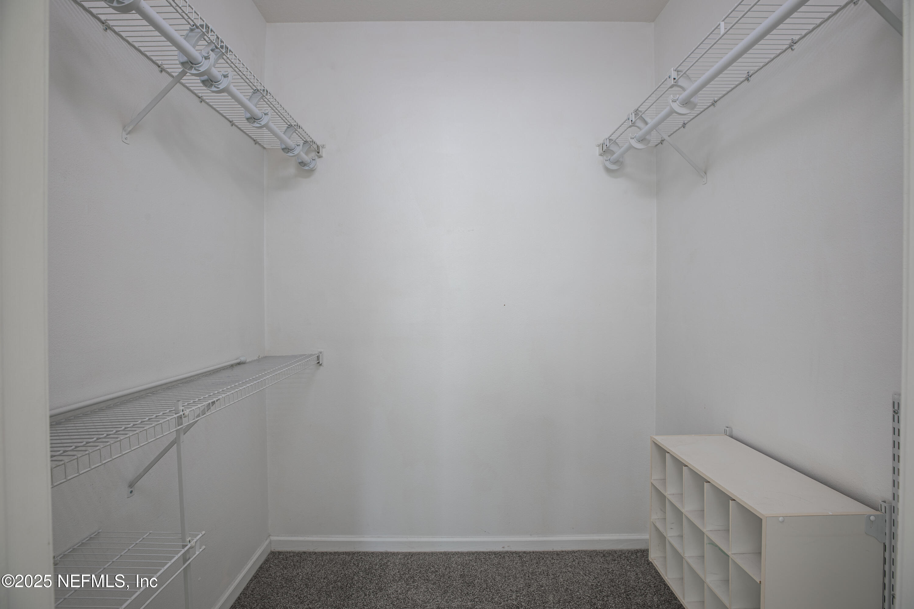 7990 Baymeadows Road, Unit 625 Jacksonville, FL 32256 - Photo 13 of 25 a view of a room with racks on the wall