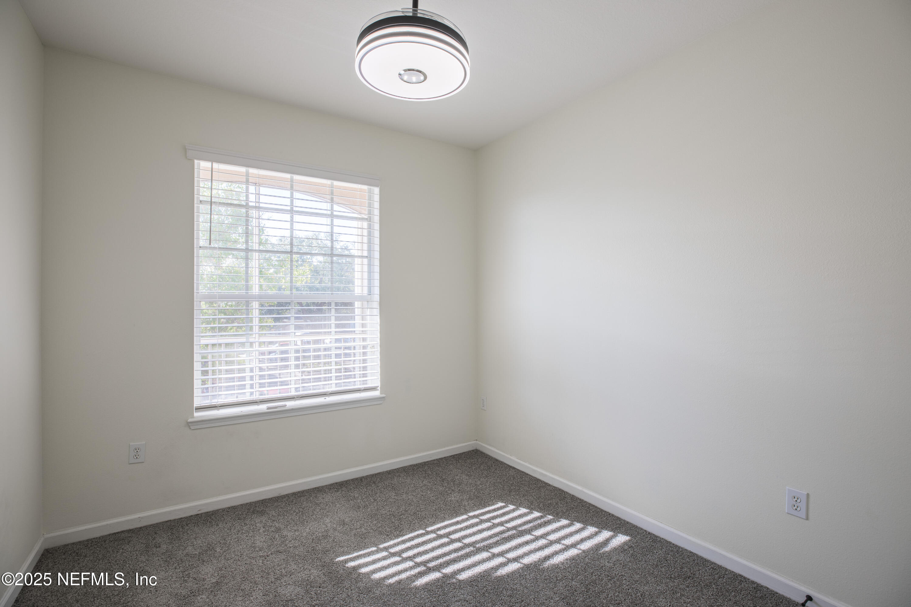 7990 Baymeadows Road, Unit 625 Jacksonville, FL 32256 - Photo 15 of 25 an empty room with a window