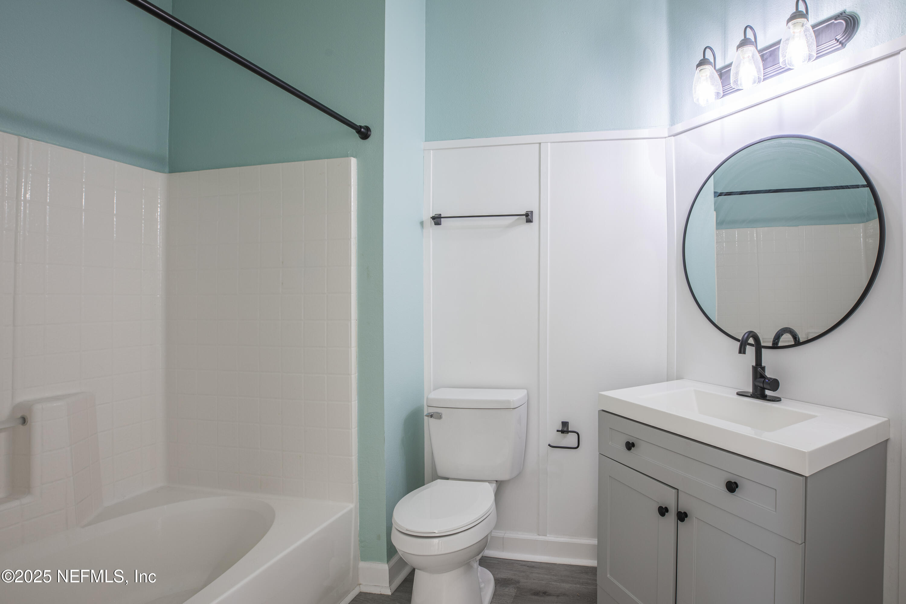 7990 Baymeadows Road, Unit 625 Jacksonville, FL 32256 - Photo 16 of 25 a bathroom with a sink toilet and a mirror