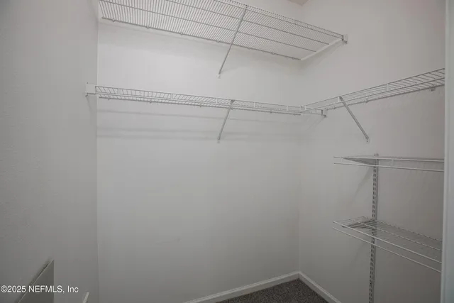 a view of a room with racks on the wall