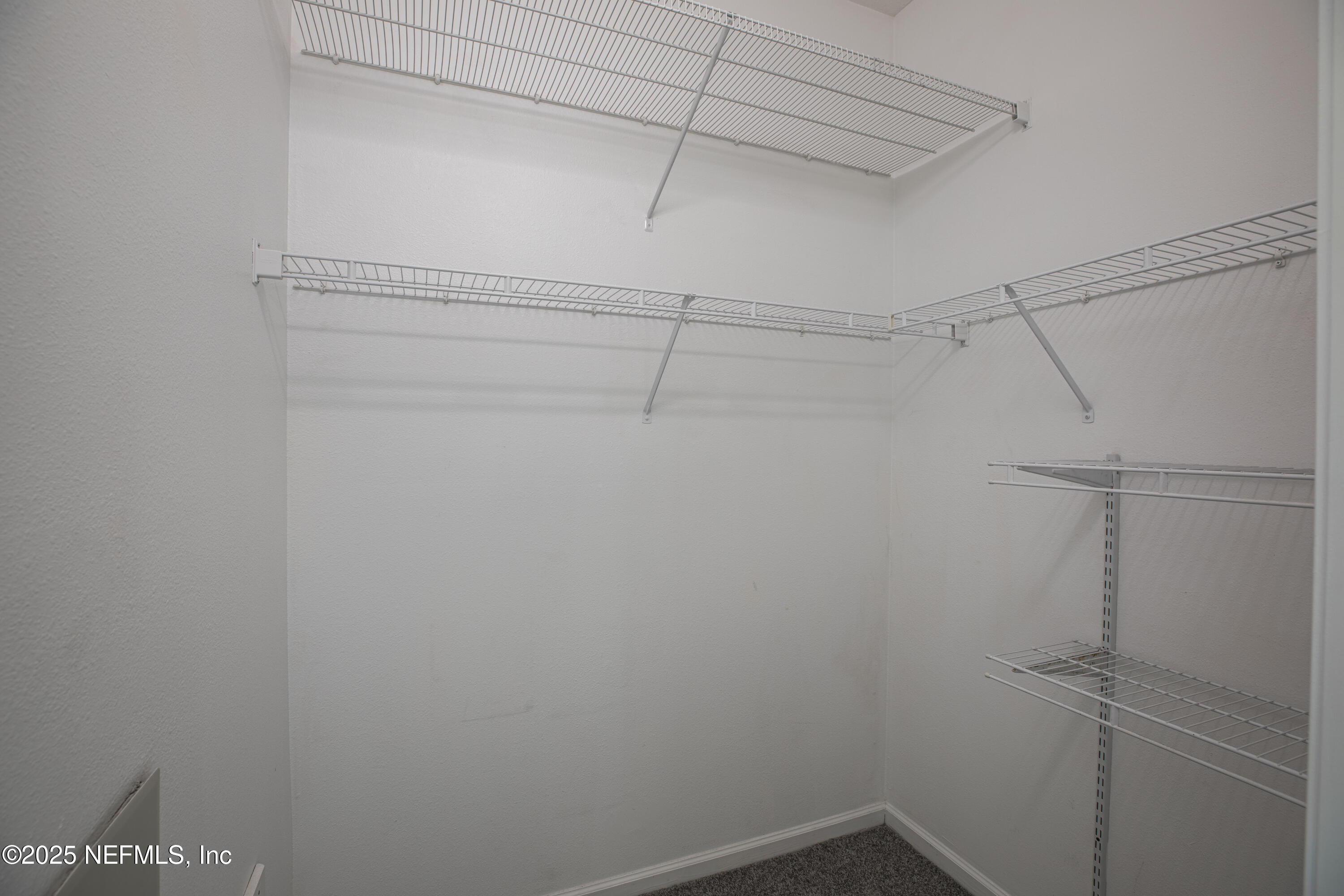 7990 Baymeadows Road, Unit 625 Jacksonville, FL 32256 - Photo 17 of 25 a view of a room with racks on the wall