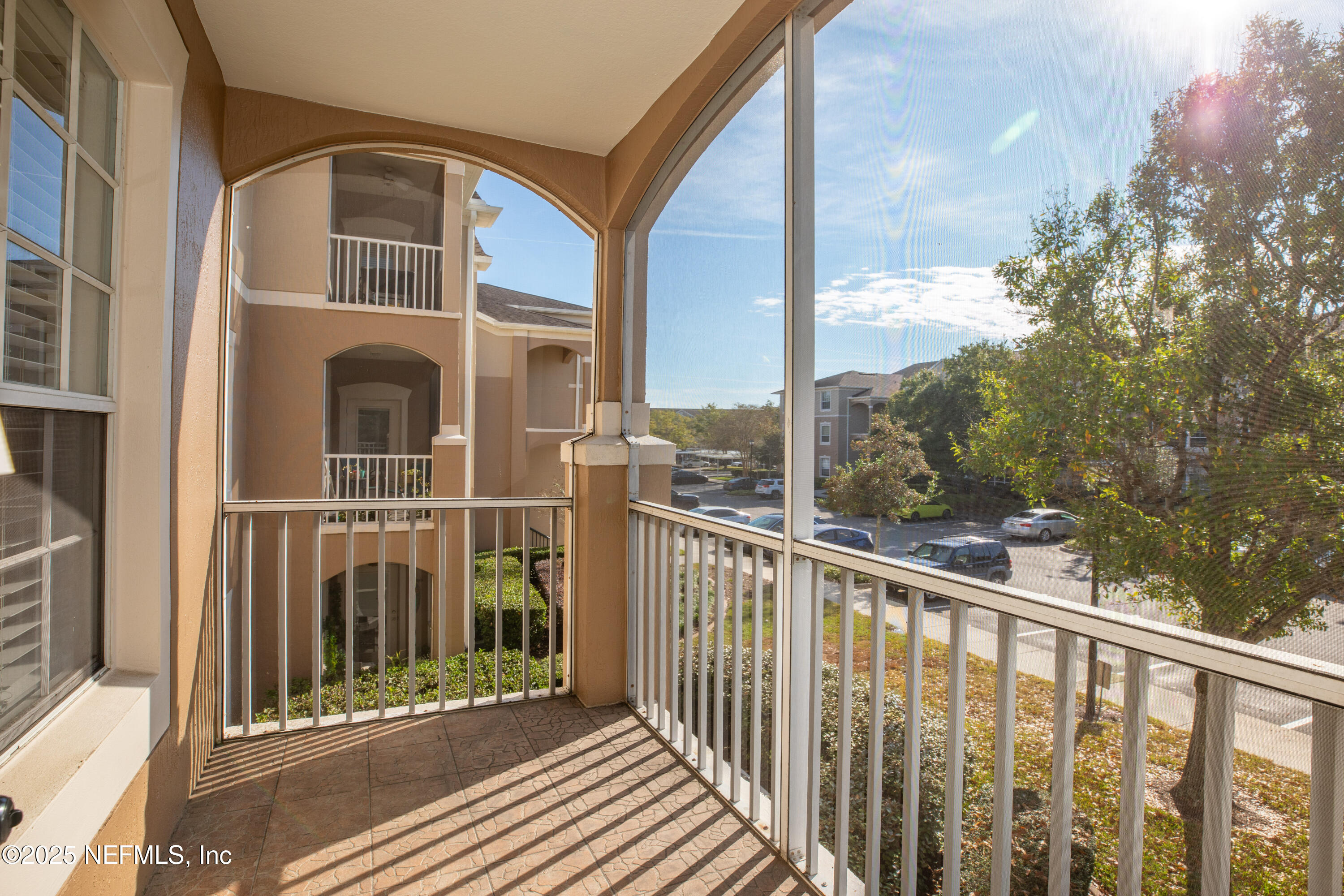 7990 Baymeadows Road, Unit 625 Jacksonville, FL 32256 - Photo 19 of 25 a view of a balcony with a tree