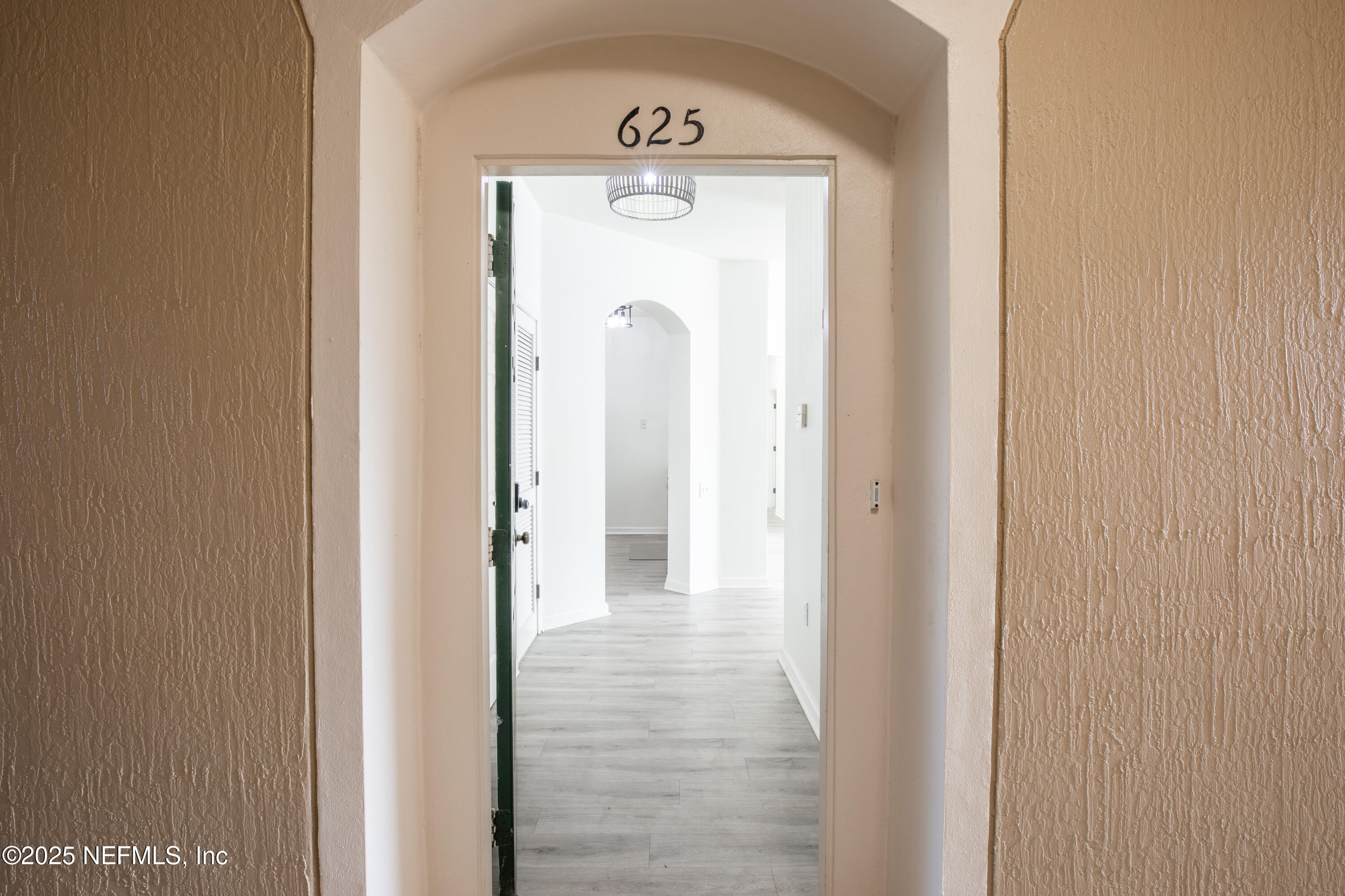 7990 Baymeadows Road, Unit 625 Jacksonville, FL 32256 - Photo 2 of 25 a view of a hallway with wooden door