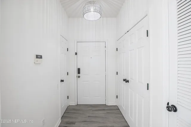 a view of a bathroom with a sink and a mirror