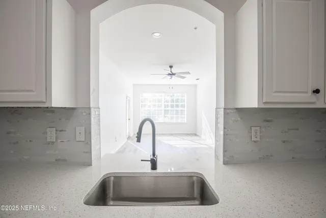a kitchen with a sink and cabinets