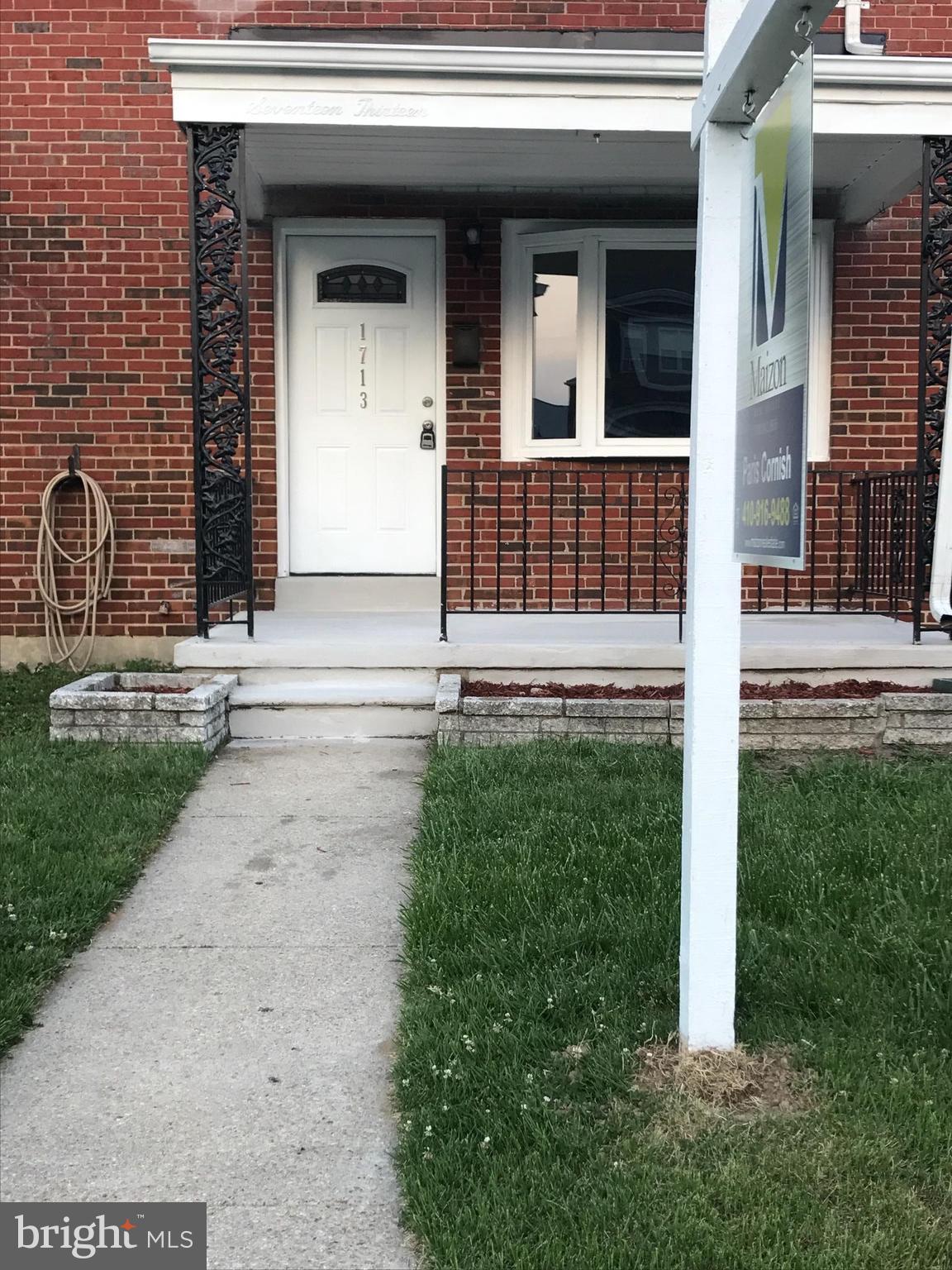 1713 Stokesley Road Baltimore, MD 21222 - Photo 1 of 15 a view of brick house with a yard