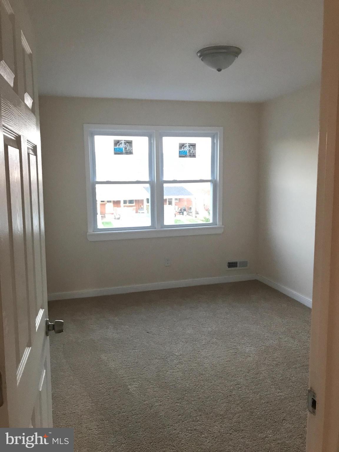 1713 Stokesley Road Baltimore, MD 21222 - Photo 13 of 15 a view of an empty room with a window