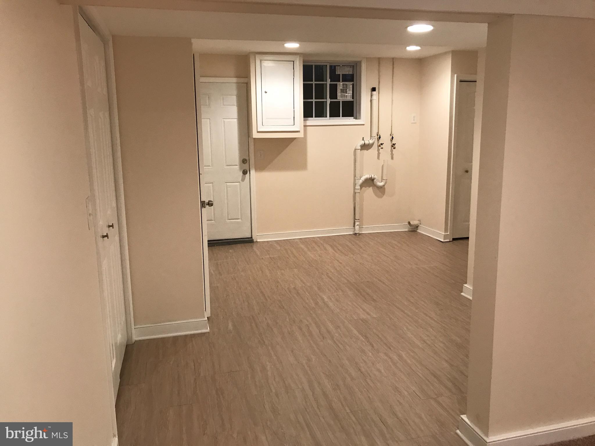 1713 Stokesley Road Baltimore, MD 21222 - Photo 8 of 15 a view of empty room with wooden floor