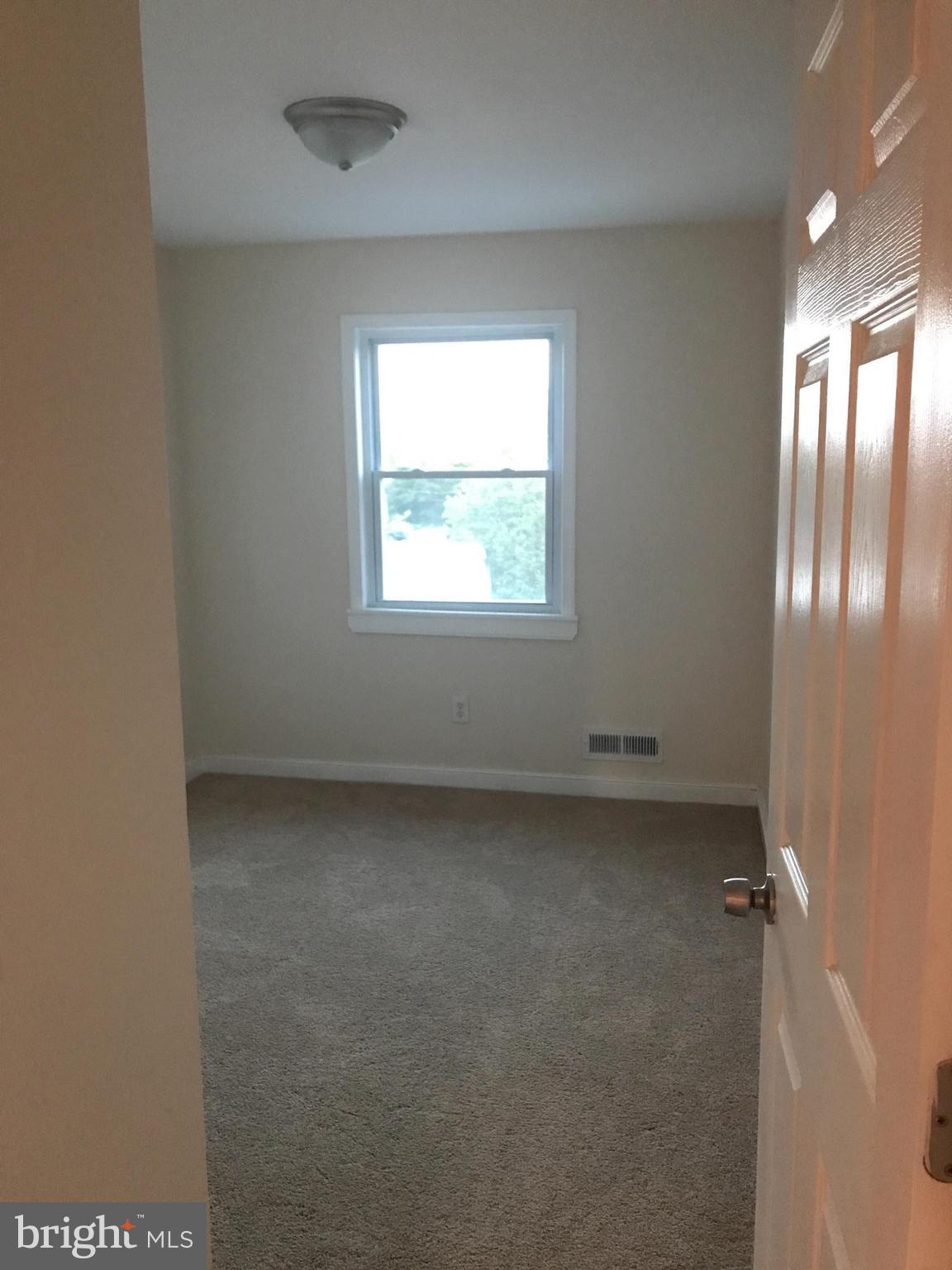 1713 Stokesley Road Baltimore, MD 21222 - Photo 10 of 15 an empty room with a window