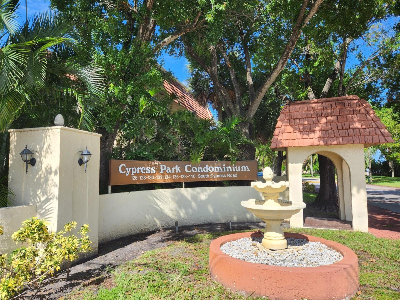 138 South Cypress Road, Unit 217 Pompano Beach, FL 33060 - Photo 14 of 21 a front view of a house with garden