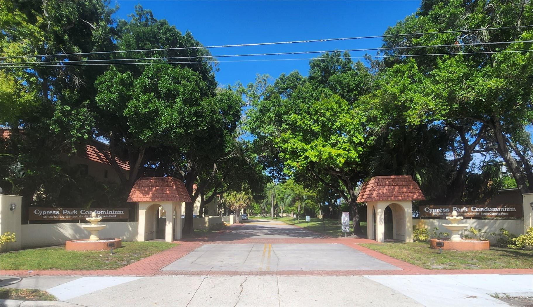 138 South Cypress Road, Unit 217 Pompano Beach, FL 33060 - Photo 8 of 21 a view of a street with houses on both side