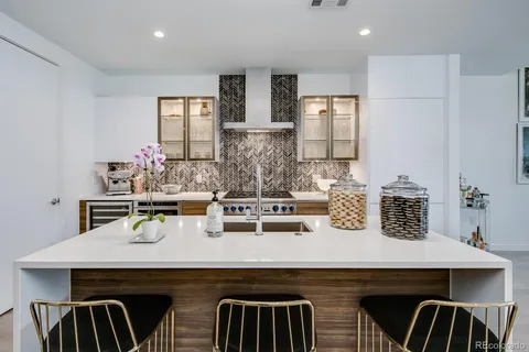 a kitchen with a sink a cabinets and counter space