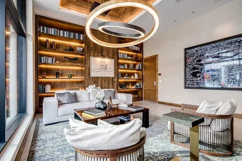 a living room with furniture and a rug