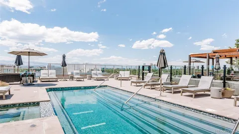 a view of a patio with swimming pool table and chairs