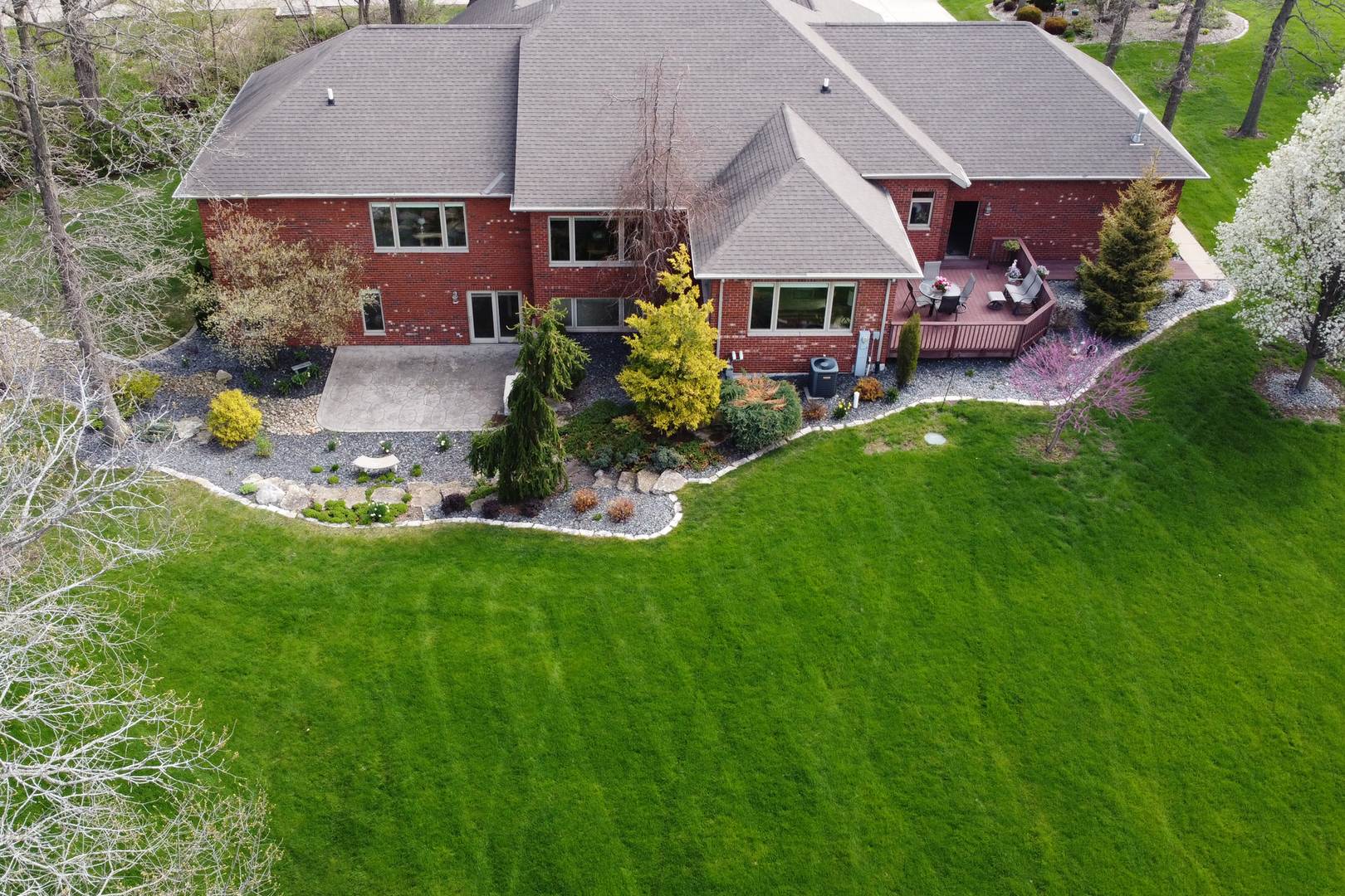 41 Oak Ridge Drive LaSalle, IL 61301 - Photo 30 of 38 a aerial view of a house with table and chairs under an umbrella