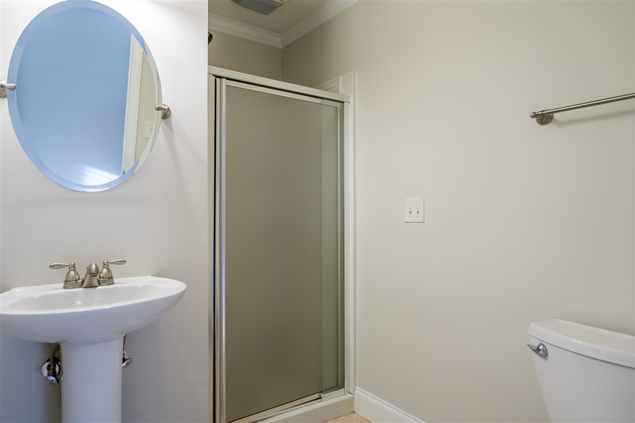 714 New Road Raleigh, NC 27608 - Photo 17 of 25 En suite bathroom is tucked inside the owner's bedroom retreat. Bathroom