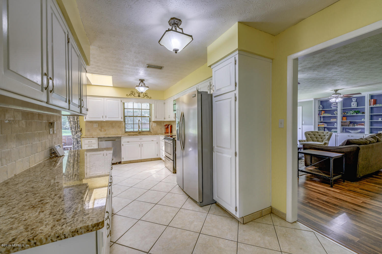 17525 Eagle Bend Boulevard Jacksonville, FL 32226 - Photo 11 of 49 a view of a kitchen with refrigerator and cabinets
