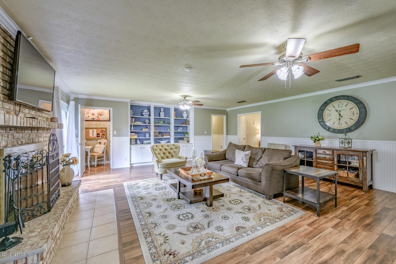 17525 Eagle Bend Boulevard Jacksonville, FL 32226 - Photo 18 of 49 a living room with fireplace furniture and a flat screen tv