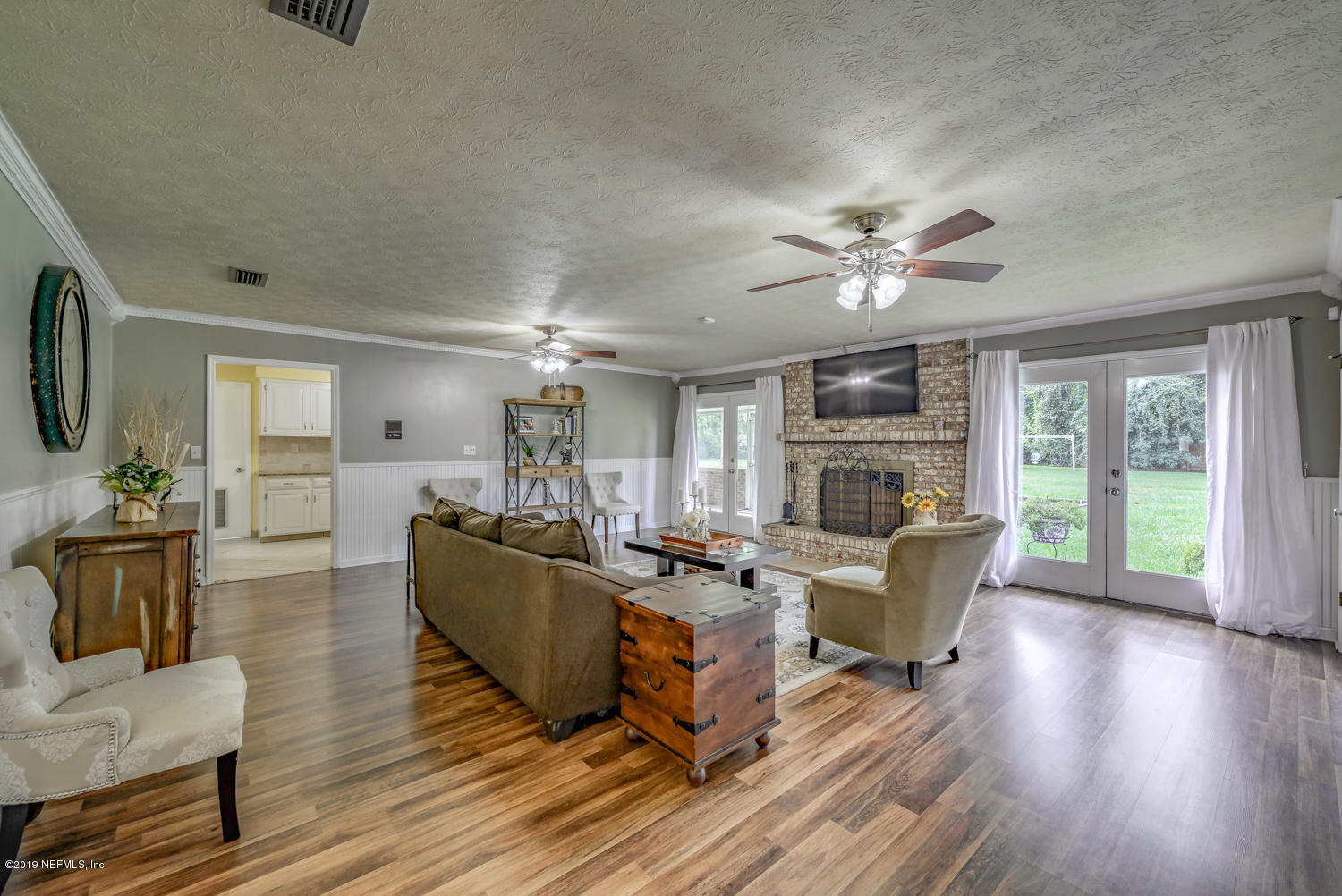17525 Eagle Bend Boulevard Jacksonville, FL 32226 - Photo 19 of 49 a living room with furniture and a fireplace