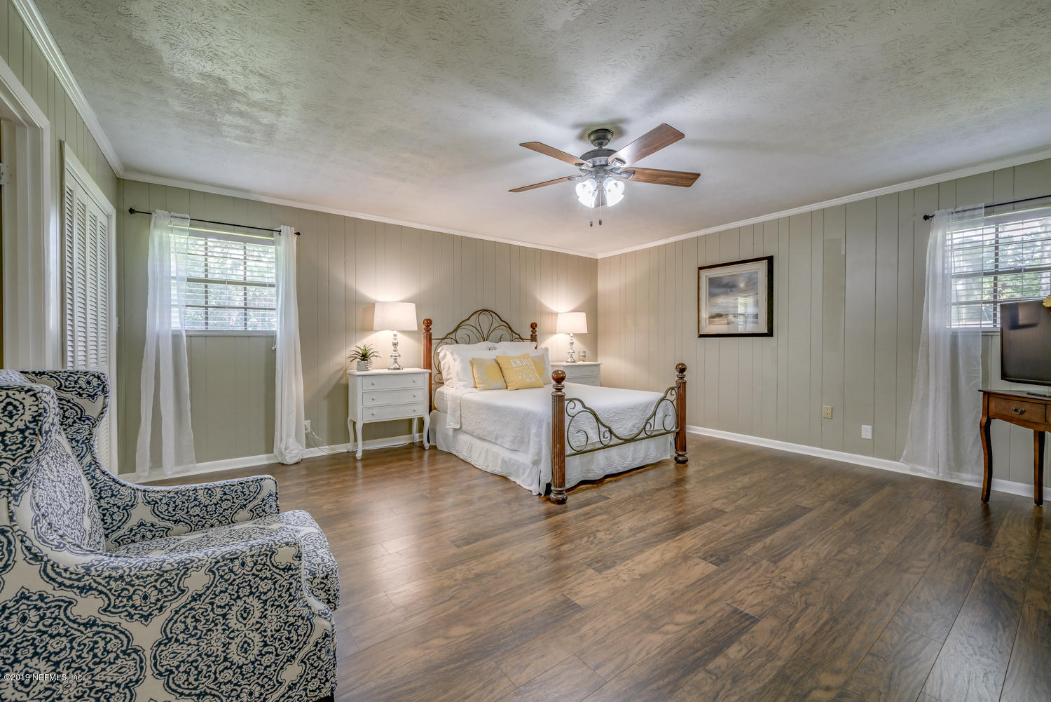 17525 Eagle Bend Boulevard Jacksonville, FL 32226 - Photo 21 of 49 a spacious bedroom with a bed and a chandelier