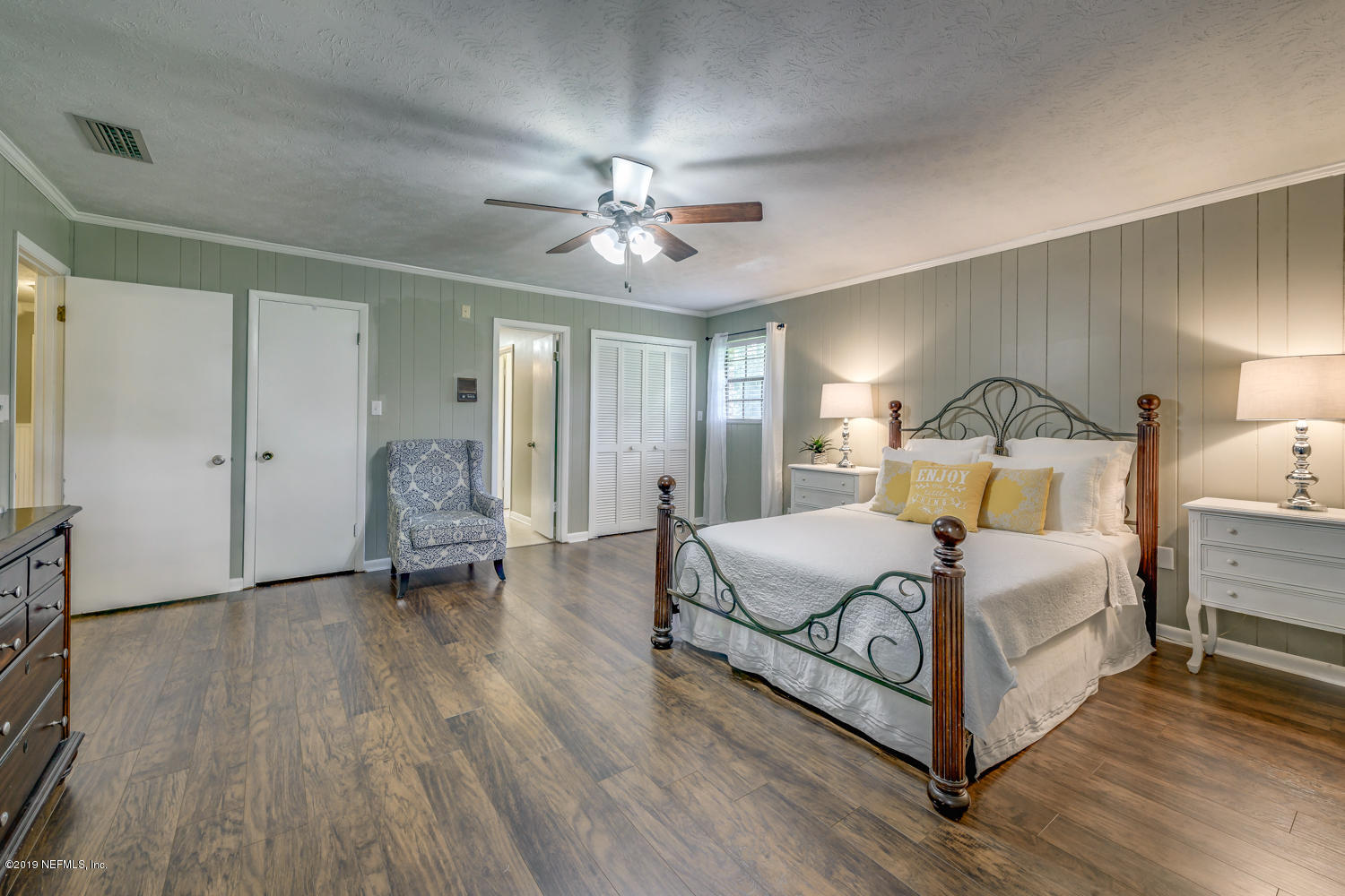 17525 Eagle Bend Boulevard Jacksonville, FL 32226 - Photo 22 of 49 a bedroom with a bed and a chandelier