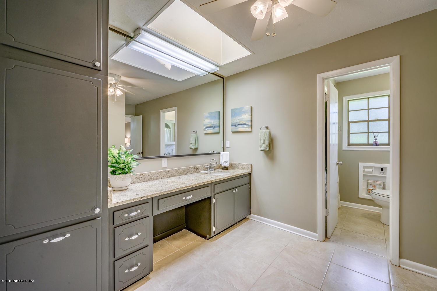 17525 Eagle Bend Boulevard Jacksonville, FL 32226 - Photo 23 of 49 a bathroom with a granite countertop sink a mirror and a shower