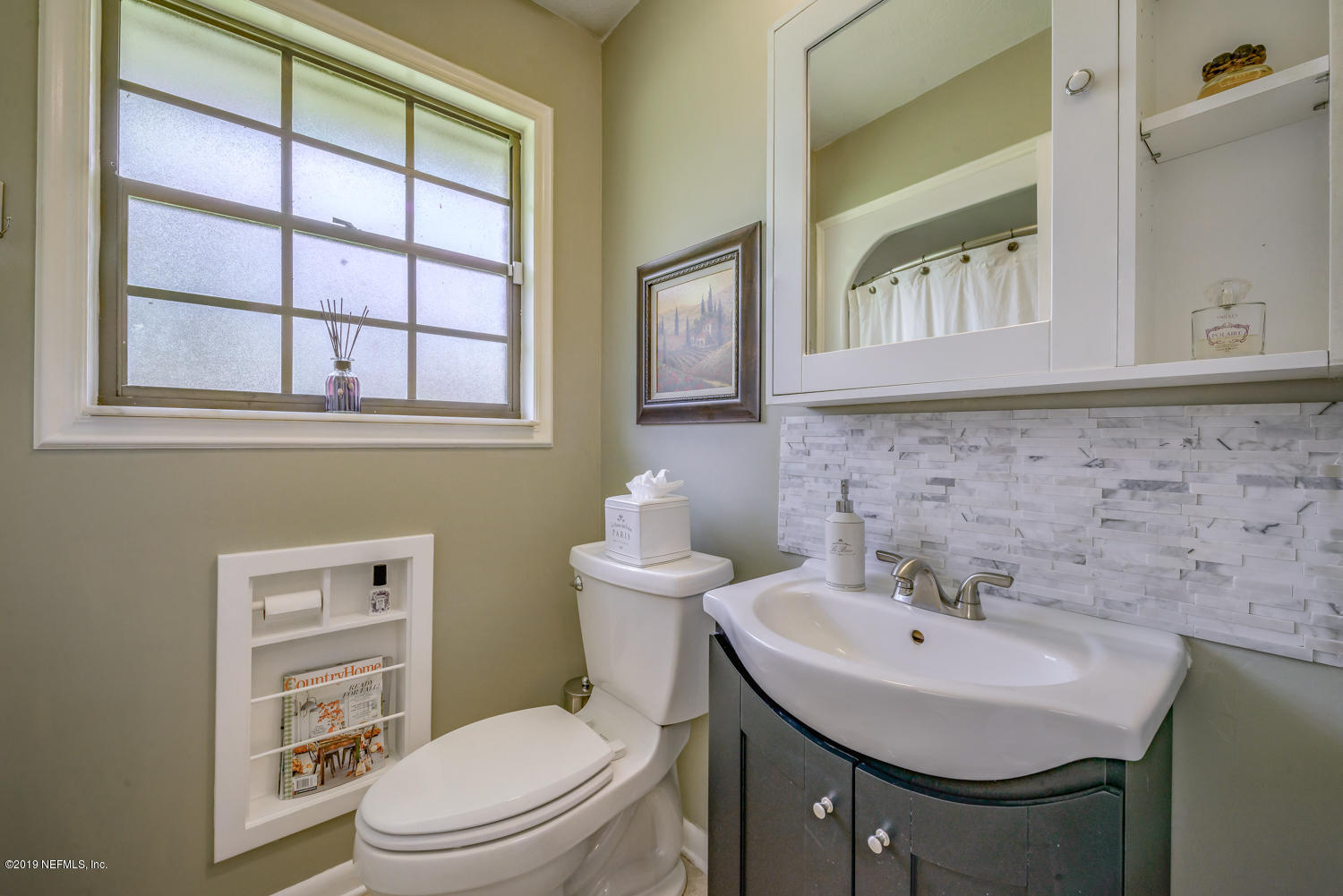 17525 Eagle Bend Boulevard Jacksonville, FL 32226 - Photo 24 of 49 a bathroom with a sink a toilet and a mirror