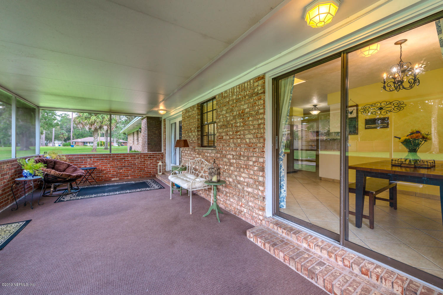 17525 Eagle Bend Boulevard Jacksonville, FL 32226 - Photo 28 of 49 a living room filled with furniture and a garden