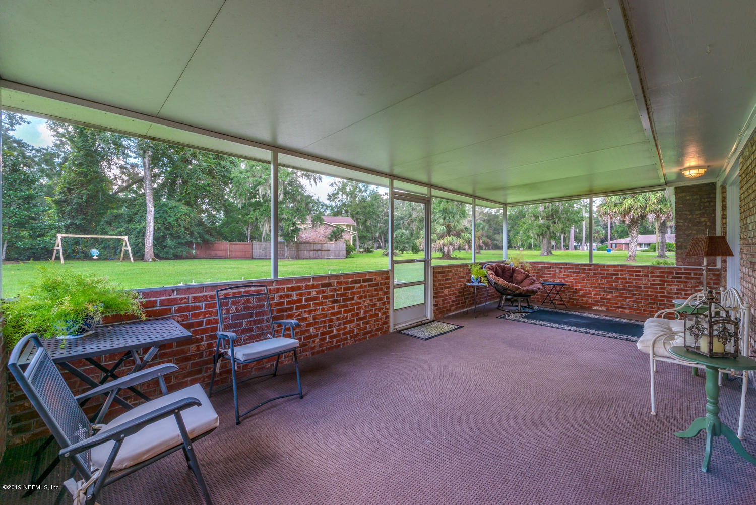 17525 Eagle Bend Boulevard Jacksonville, FL 32226 - Photo 29 of 49 a view of a chair and tables in the patio