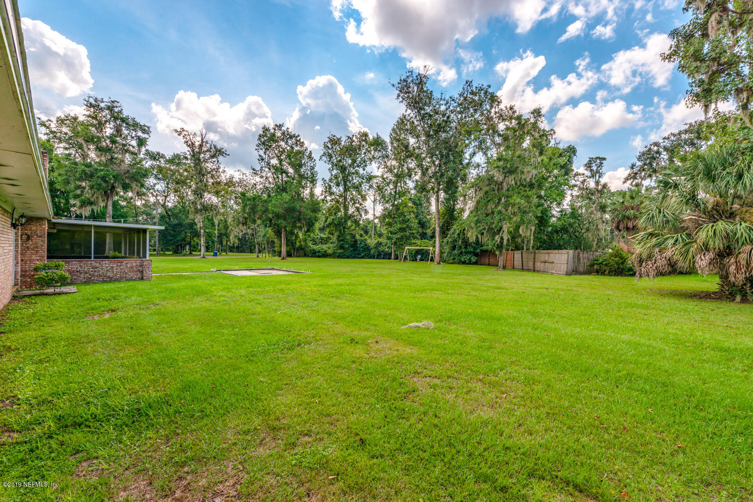 17525 Eagle Bend Boulevard Jacksonville, FL 32226 - Photo 33 of 49 a backyard of a house with lots of green space