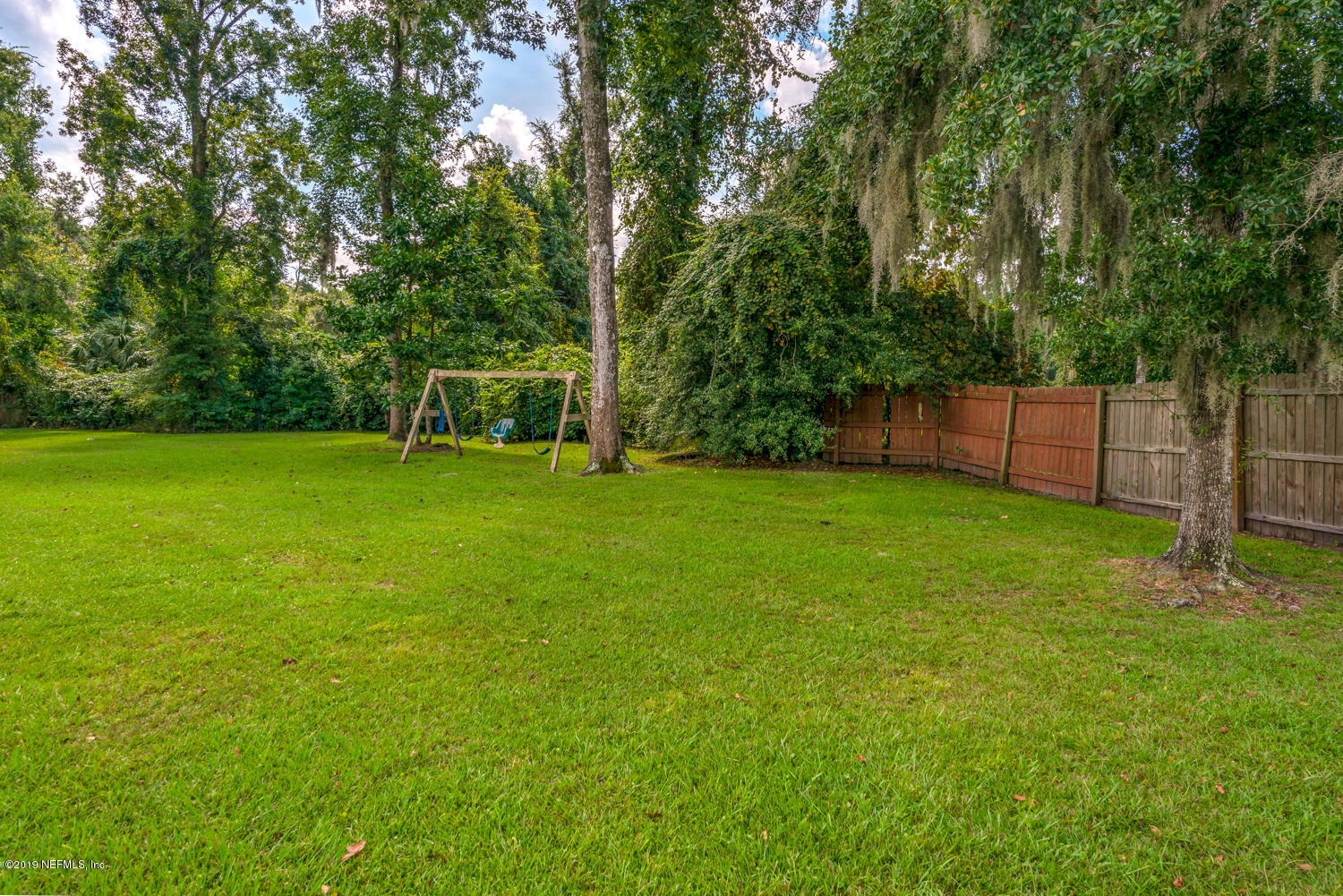 17525 Eagle Bend Boulevard Jacksonville, FL 32226 - Photo 34 of 49 a view of a field of grass and trees