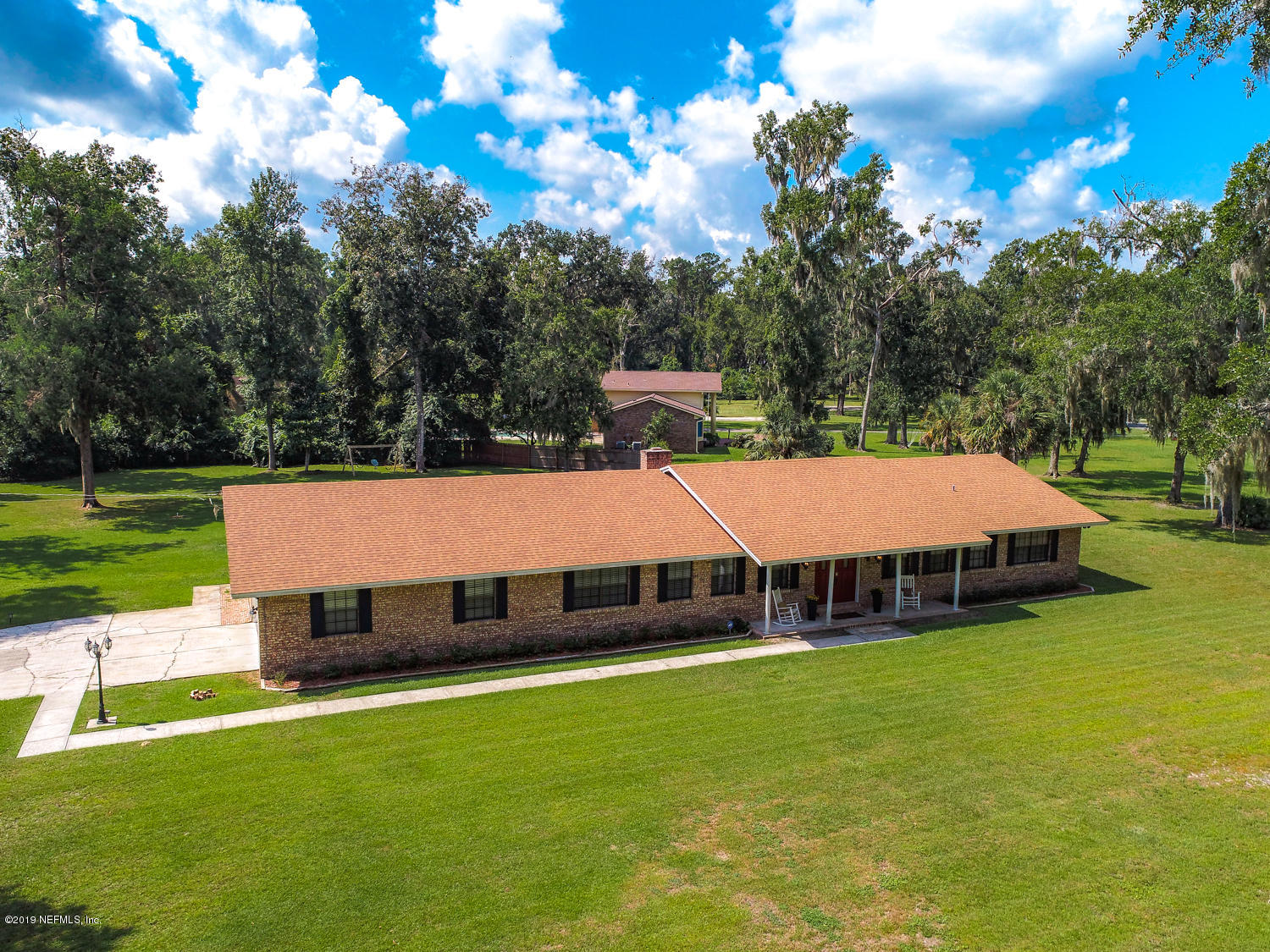 17525 Eagle Bend Boulevard Jacksonville, FL 32226 - Photo 36 of 49 a view of a swimming pool with lawn chairs and a yard