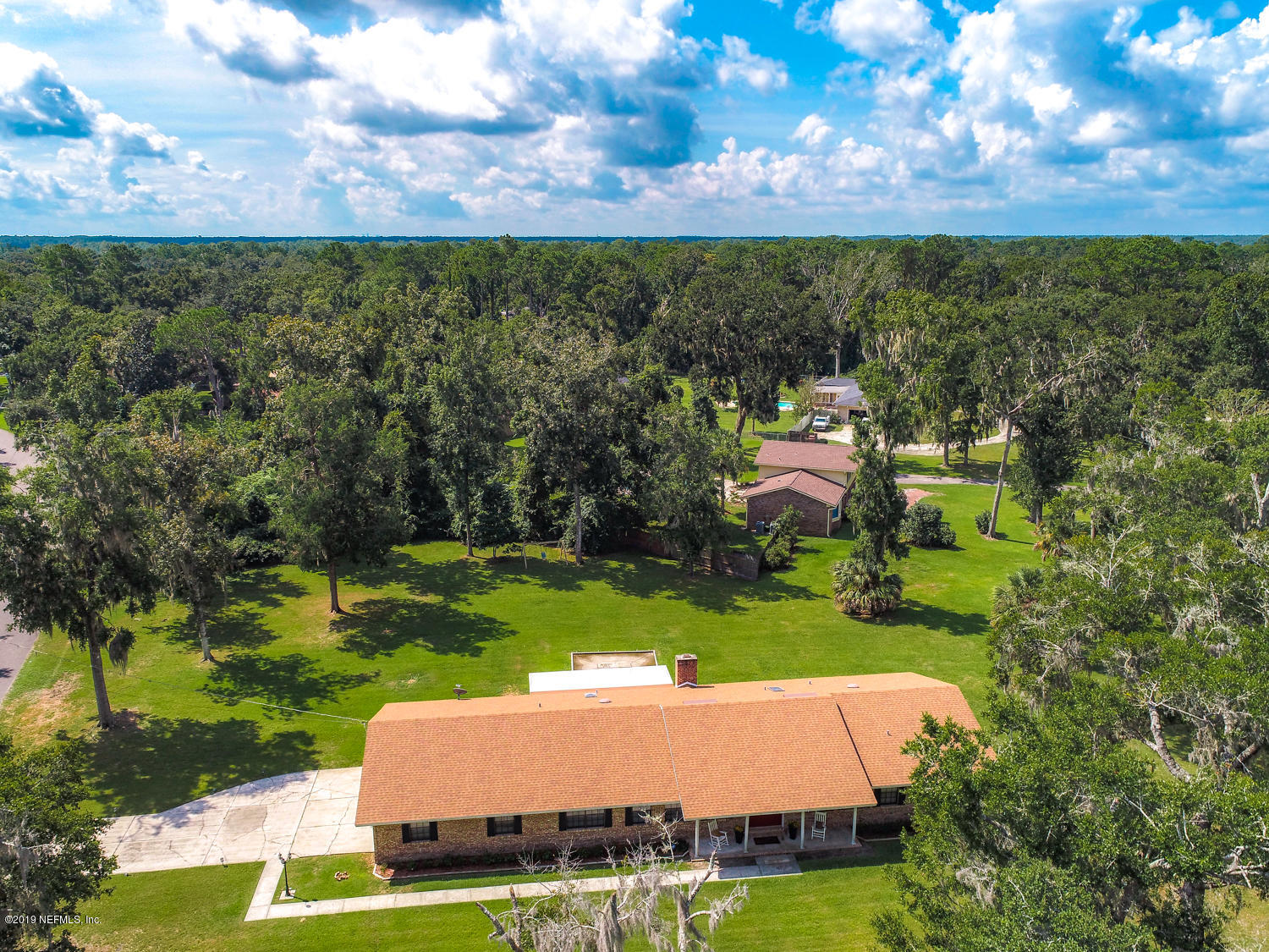 17525 Eagle Bend Boulevard Jacksonville, FL 32226 - Photo 37 of 49 a view of a garden with a building in the background