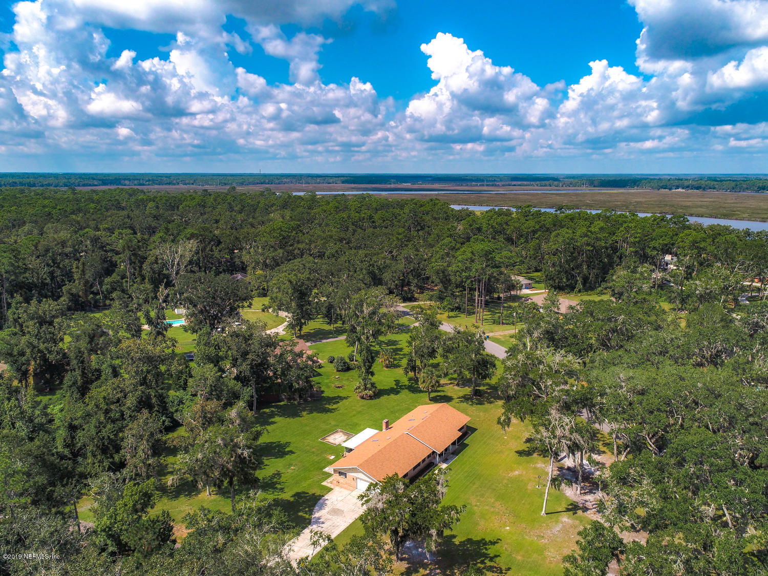 17525 Eagle Bend Boulevard Jacksonville, FL 32226 - Photo 41 of 49 a view of a yard with a house in the background
