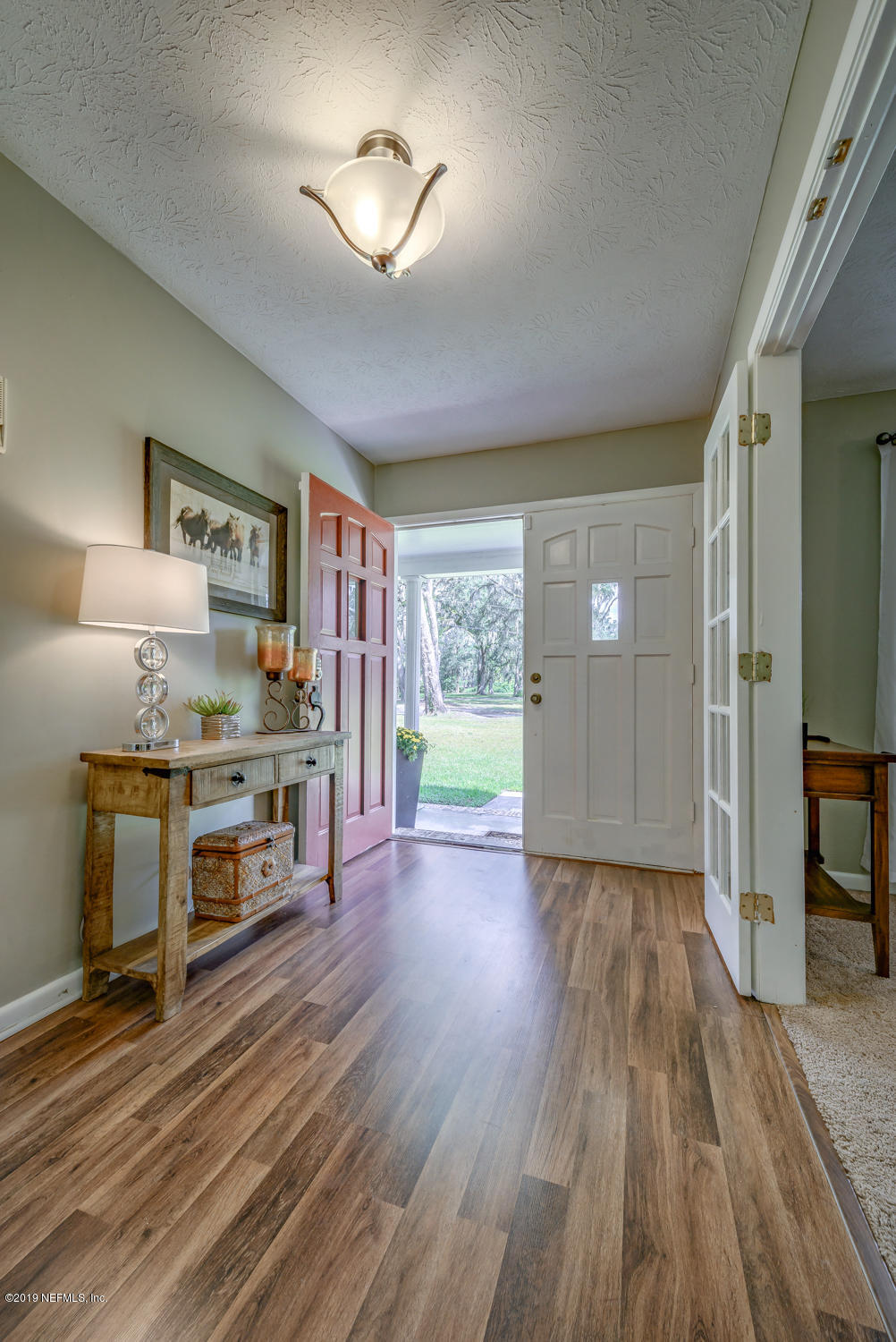17525 Eagle Bend Boulevard Jacksonville, FL 32226 - Photo 6 of 49 a open kitchen with cabinets stove and wooden floor