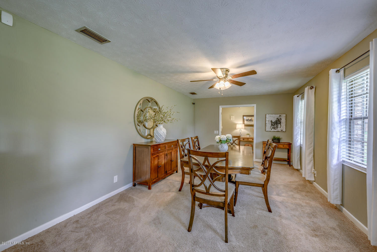 17525 Eagle Bend Boulevard Jacksonville, FL 32226 - Photo 9 of 49 a view of a dining room with furniture and a large window