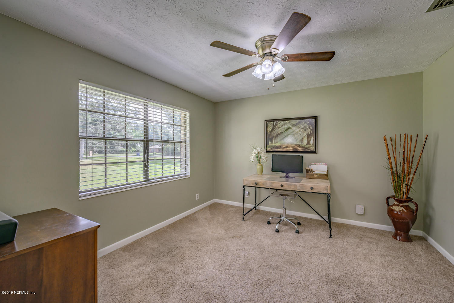 17525 Eagle Bend Boulevard Jacksonville, FL 32226 - Photo 10 of 49 a view of a workspace with furniture and a window