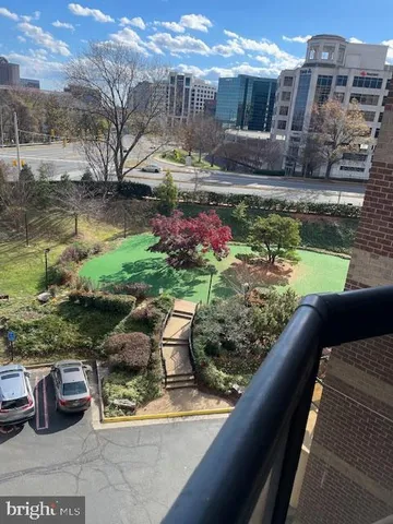 a view of a lake with cars parked
